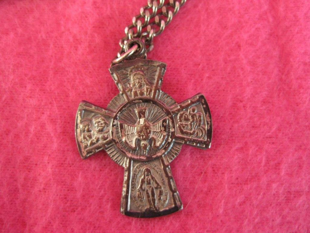 Silver cross worn by Agnes Swift during her military service. An engraved message on the reverse tells others that she is a Roman Catholic and to summon a priest if she is seriously injured or ill.