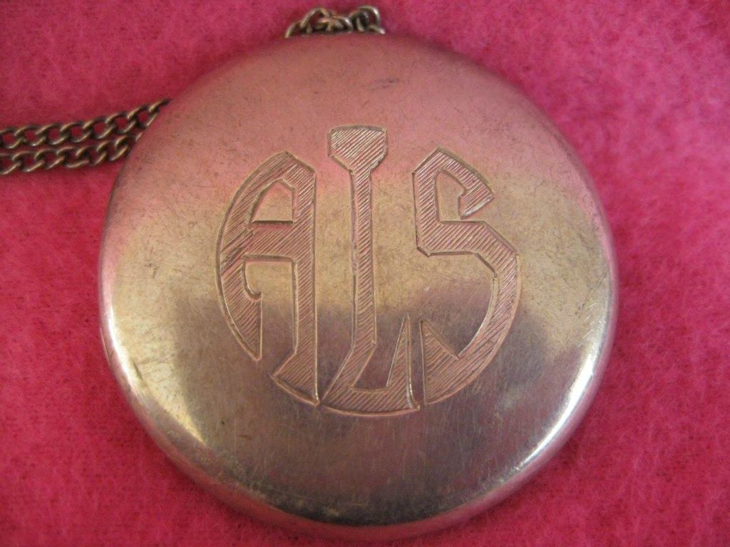 Silver locket (identification tag) - a gift from C. J. Wilson to Agnes Swift