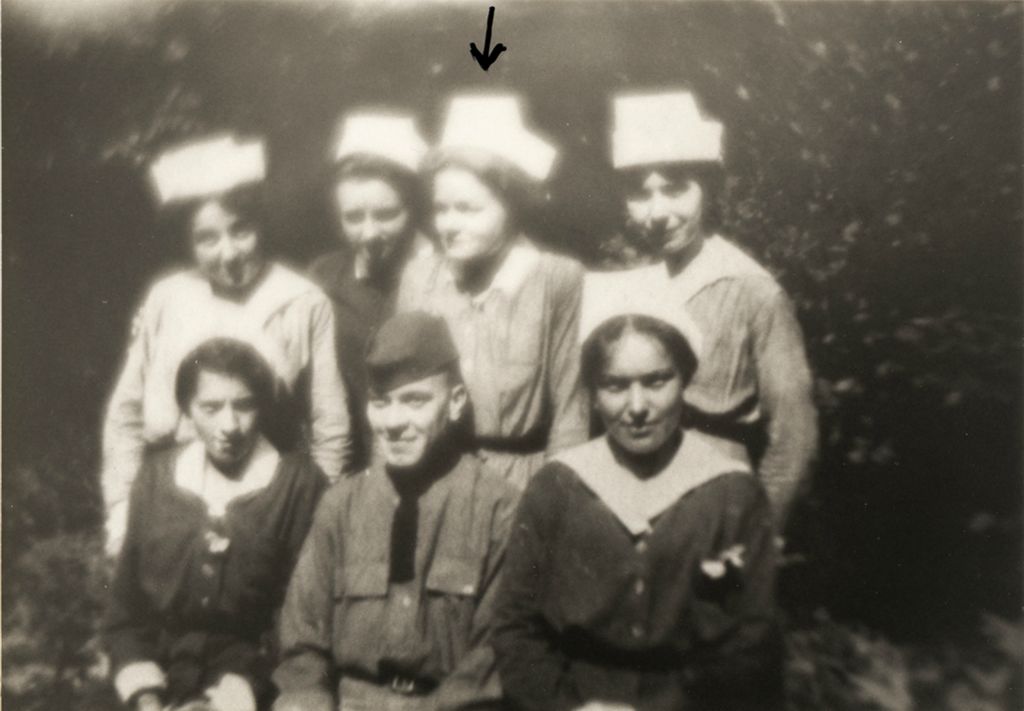 Agnes Swift (arrow) and others from WWI service, 1917, possibly in Contrexeville