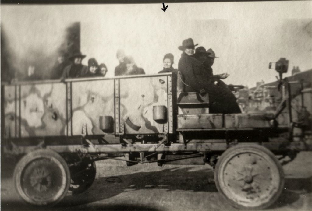 Agnes Swift, sitting behind the front seat, on the way to church - Contrexeville 1918-1919