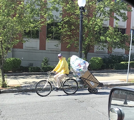 bicyclist carrying lots of stuff