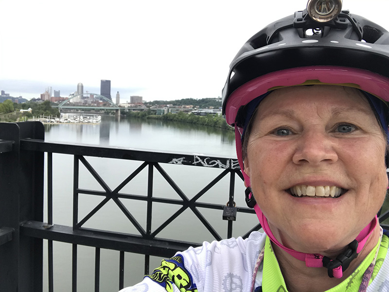 Molly on the Hot Metal Bridge, with a view of downtown Pittsburgh in the background