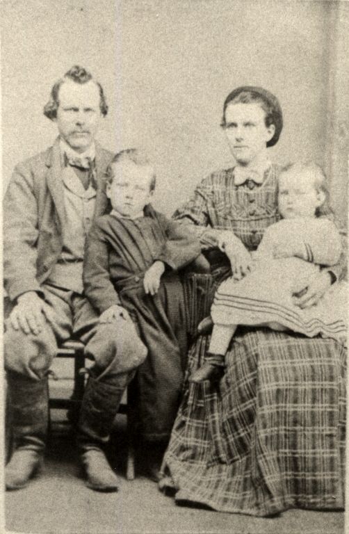 John C. and Mary C. Rimmer Swift, with children George and Mary Emma. Taken ~1870 in Washington IA.
