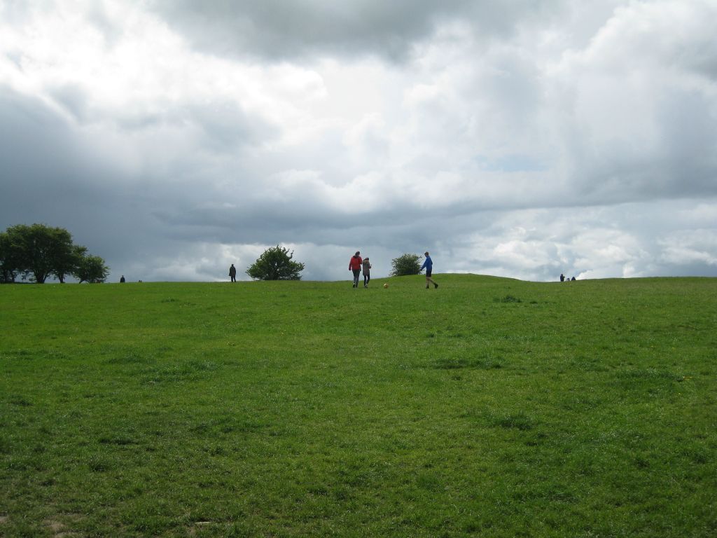 Boys playing football (soccer) on the Hill of Tara