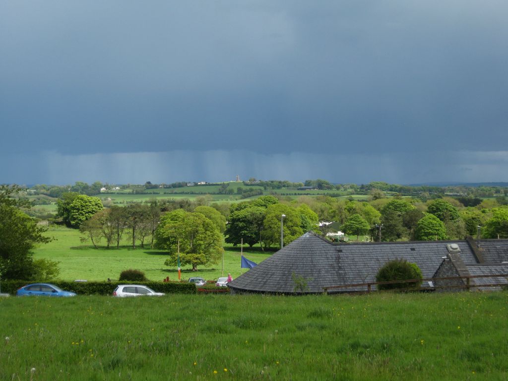 The high point in the distance, in the rain clouds, is the Hill of Slane, viewed from the Hill of Tara