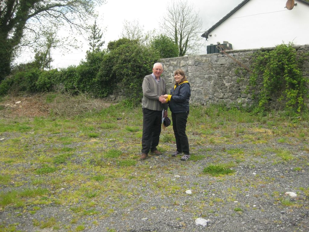 Benny Downey chats with Martha Clark, on the site where John Cooney and Mary Cahill had lived. 