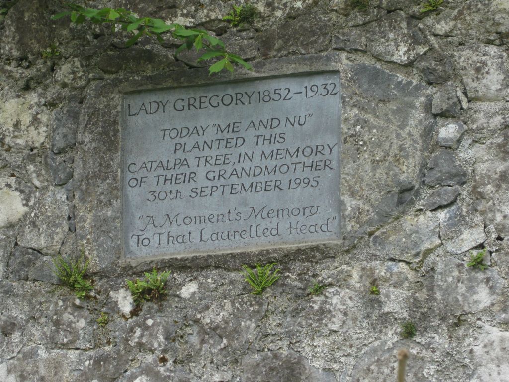 A plaque placed by the granddaughters of Lady Gregory, known by their nicknames "Me and Nu."  In earlier times, an old catalpa tree was a favorite of Lady Gregory, and a well-known image of her at the base of the tree inspired this tribute.
