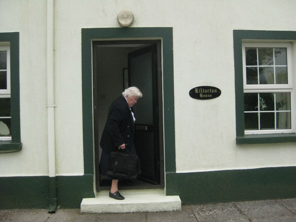 Sister DeLourdes at the door of Kiltartan House. Her sister Rena now owns the house which was once a home where the Swifts lived.