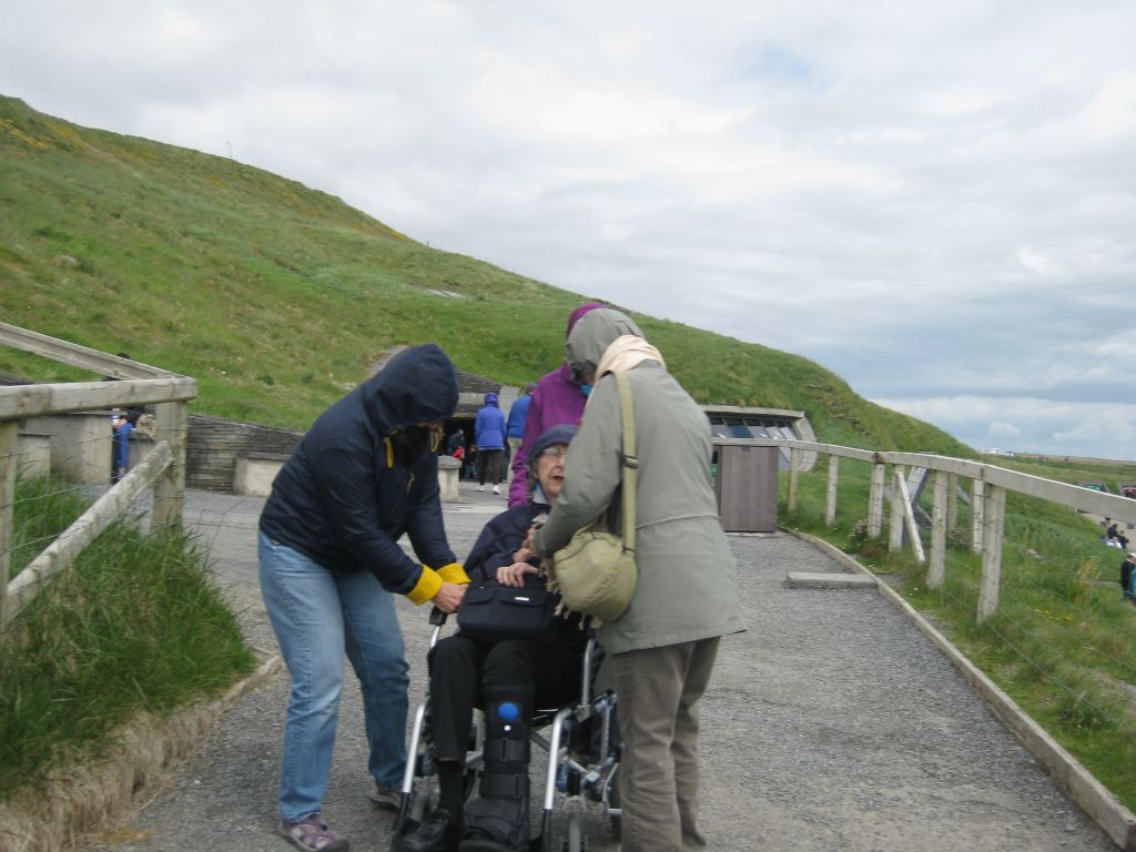 As we started up the path to the Cliffs of Moher, I turned to take a photo of my sisters helping Mom navigate the wheelchair up the path. Then I realized that the image looks like they are mugging Mom and trying to take her purse! Sara suggested we could post it on Facebook and tell everyone "Mom's paying for everything on our trip!"