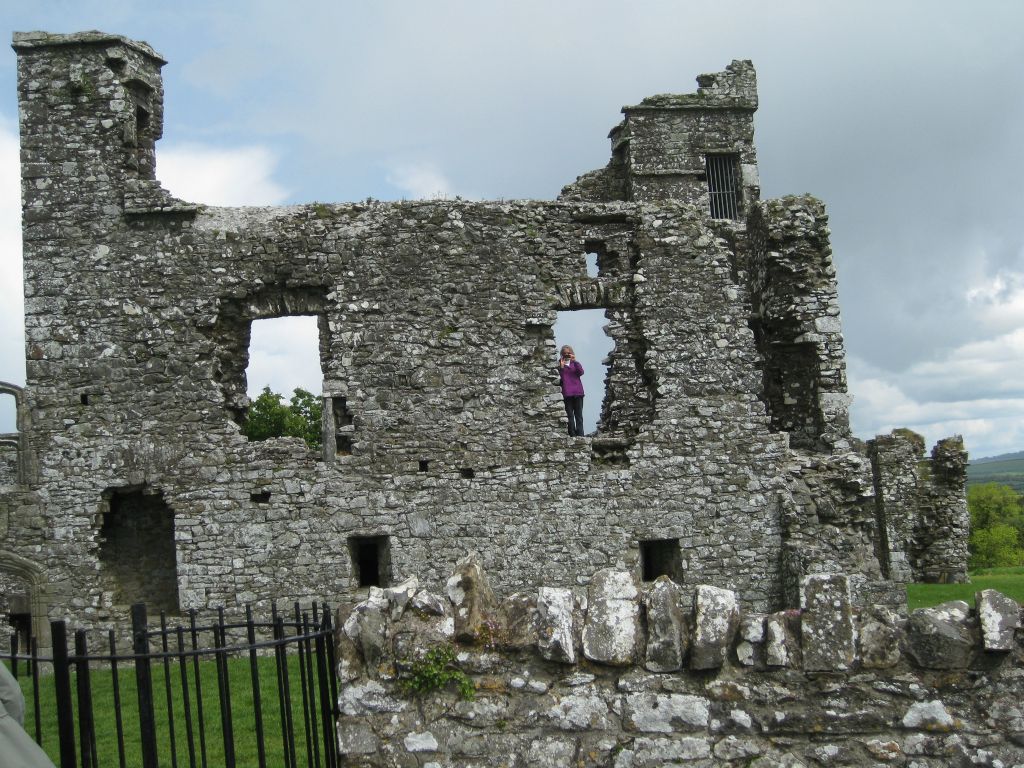 Annis snaps a photo from the window frame of the ruins of an old college at the Hill of Slane