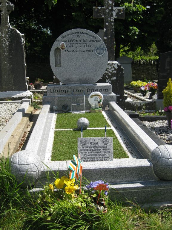 The resting place of Shane Whelan (Wheela) at Monasterboice (no known relation.) His grave is a football (soccer) field, and he died at the age of 29 years.