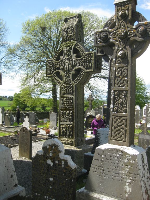 In the background is Muiredach's Cross at Monasterboice, one of the best preserved high crosses in the country.