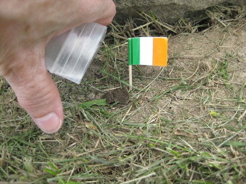 Placing soil at John's grave